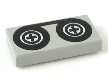 Part 3069p02 - Tile 1 x 2 with Black Tape Reels Pattern - De BrickPlaats
